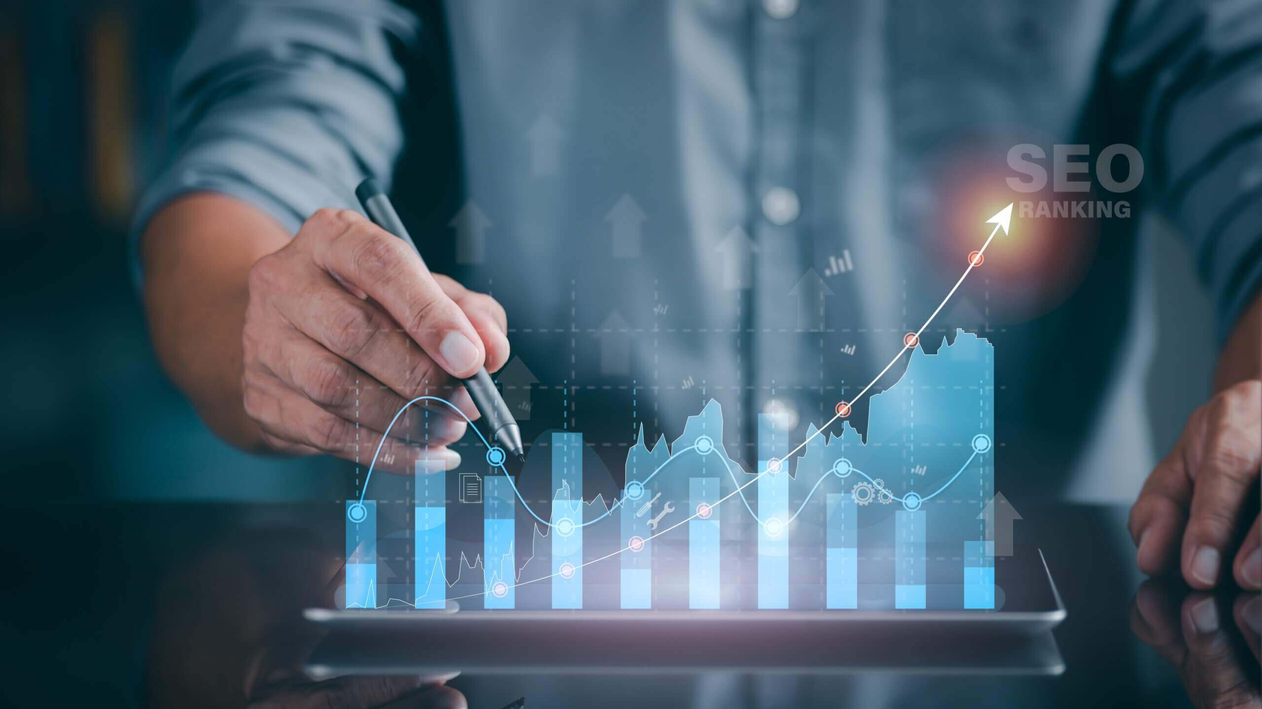 A person using a pen to show a positive trend on a graph that presents positive results in SEO rankings